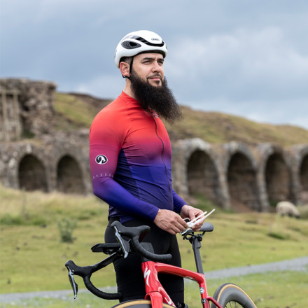 Male rider at the top of Rosedale Chimney Bank looking out at the view wearing Argyle jersey