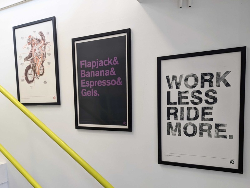 Cycling-related prints on the wall at SG HQ