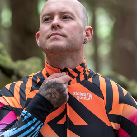 Close up of man zipping up Villain jersey
