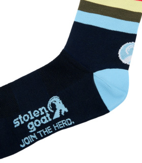 Close up of Stolen Goat Giants socks navy blue with light blue heel and toe, and multi stripe at the ankle. Stolen Goat logo and slogan on the sole