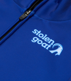 Close up of pale blue Stolen Goat logo on men's Blue Kiko jersey