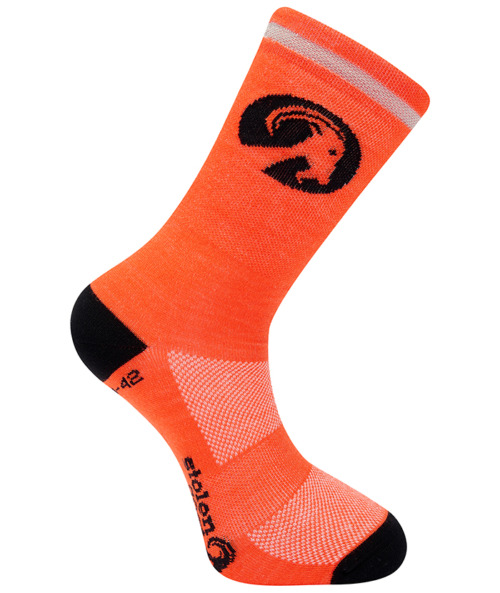 Stolen Goat Orange merino sock, bright orange block colour sock with black heel and toe, black stolen goat logo and slogan on the sole and black round goat head logo on the ankle