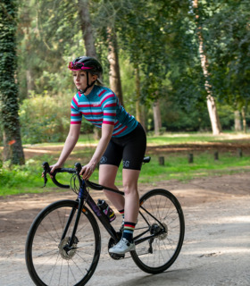 Woman riding her bike wearing Roxy jersey