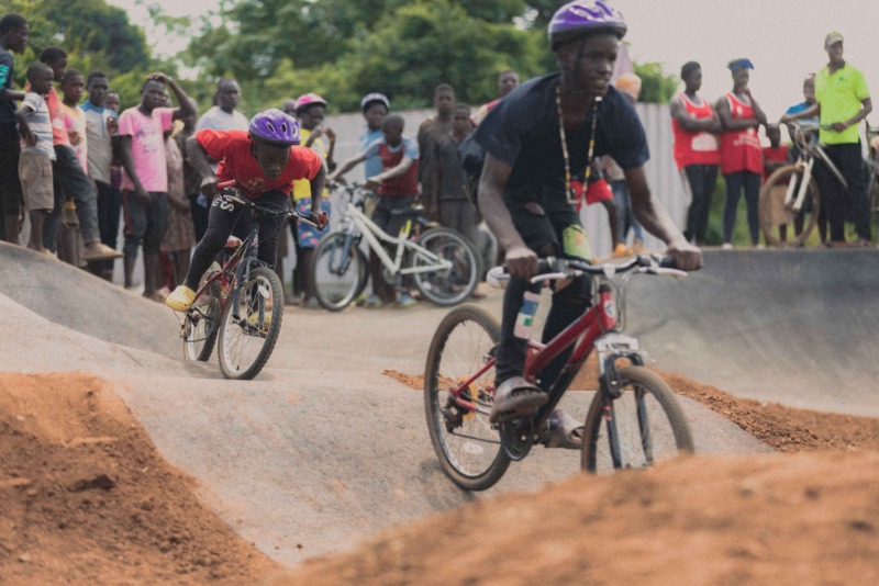 Riders on the pump track at Kasanje Bike Park