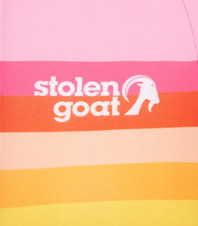 Close up of white SG logo on front of Women's Arcadia Ibex short sleeved jersey light pink with rainbow stripe