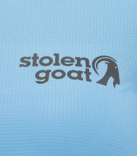 Close up of front logo on women's light blue gravel jersey