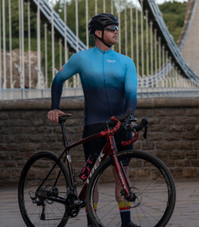 Man standing in front of Clifton Suspension Bridge wearing Neptune jersey